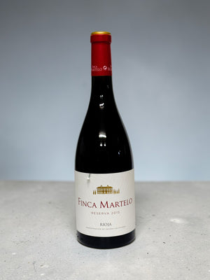 Bottle of Finca Martelo wine on a light gray background