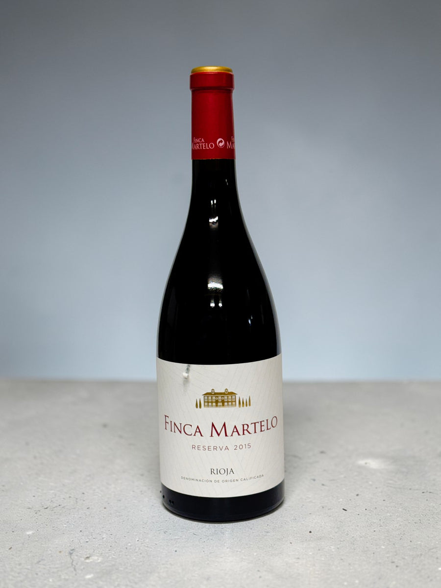 Bottle of Finca Martelo wine on a light gray background