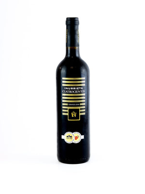 Wine bottle with gold label on a white background