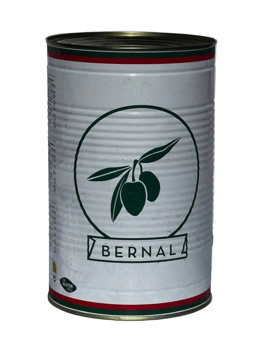 A cylindrical metal can with a white label featuring a dark green olive branch logo and the brand name 'BERNAL' in a banner, set against a neutral gray background.